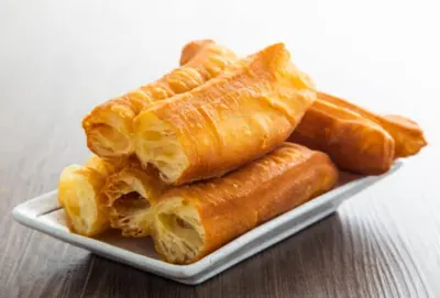 a plate of croissants sitting on a table at \u9f99\u95e8\u5ba2\u6808 in Amman