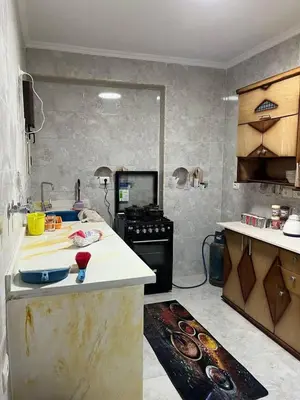 a kitchen with a counter and a stove in it at Doven Farm in Wadi Musa