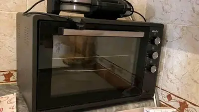 a microwave oven sitting on top of a wall at Aqaba Drought inn in Aqaba