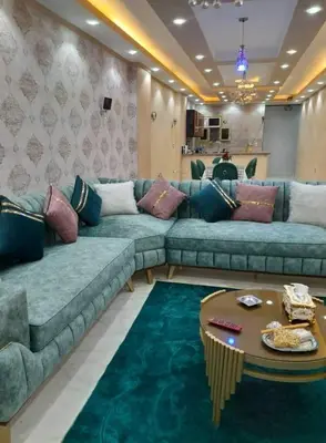 a living room with a couch and a table at Aqaba Drought inn in Aqaba