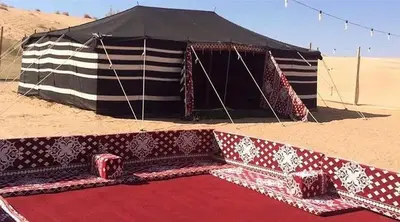 a large tent in the desert with a red carpet at Bedouin house in Wadi Rum