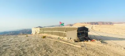 a tent in the middle of the desert at Wadi Ghowair View Camp in Al Khuraybah