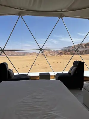 a tent with a view of the desert at The Flowers Camp in Wadi Rum