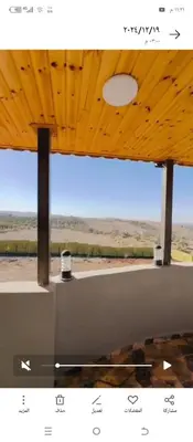 a view of the desert from a room with a window at فيلا اربد طريق البترول in Juḩfīyah