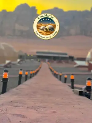 a sign that is hanging over a road at RUM MARTIAN TENT BUBBLES lUXURY CAMP in Wadi Rum
