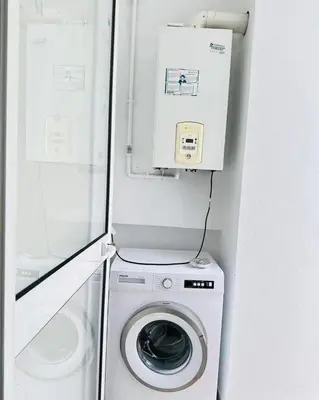 a washer and dryer in a small room at Loard House in Az Zarqa