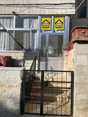 a building with signs on the front of a window at Nice comfy room in Amman