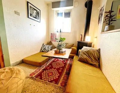 a living room with a couch and a table at Amman Antique Penthouse in Amman
