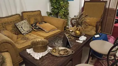 a living room with a couch and a table at over theatre apartment in Amman