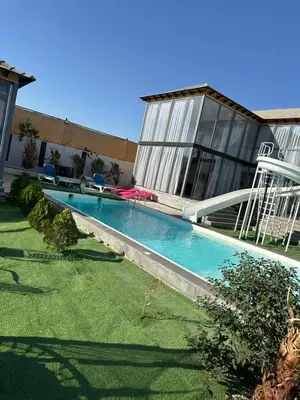 a swimming pool in the yard of a house at the royal occasion amman in Amman