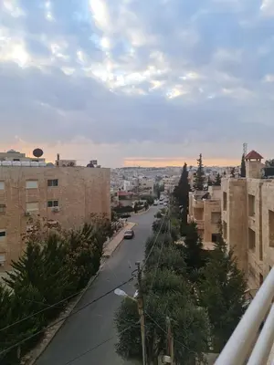 a view of a street in a city with buildings at Layal's apartment in Amman