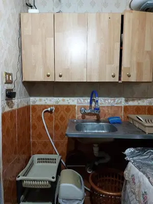 a kitchen counter with a sink and a sink at الدونق in Amman