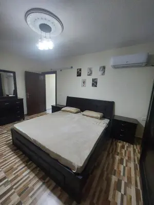 a bedroom with a large bed in a room at New zarqa20 km from Amman in Az Zarqa