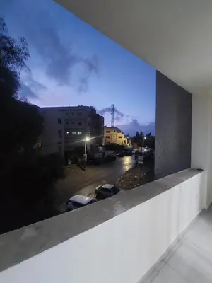 a view of a parking lot from a building at New zarqa20 km from Amman in Az Zarqa