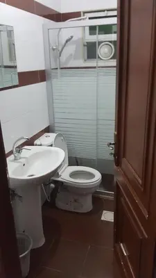 a bathroom with a toilet and a sink at رياحين الخلود للشقق الفندقية in Amman