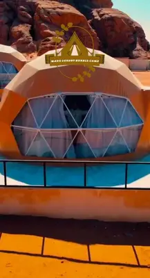 a close up of a boat on a table with pastries at RUM MARS BUBBLE lUXURY CAMP in Wadi Rum