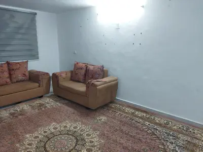 a living room with two chairs and a couch at شقة مفروشة في عجلون رأس منيف in Ajloun