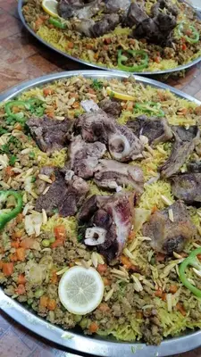 two plates of food sitting on a table at الخريطه هاوس in Tall al Misţāḩ