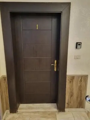 a black door in a room with at unique 2bedroom at abdoun 001 in Amman