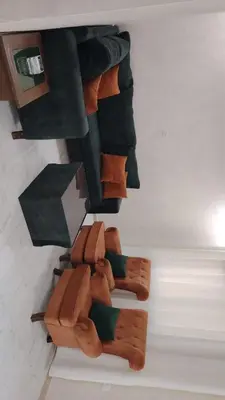 a bunch of brown socks sitting on the floor at Al Wesam Furnished Apartments in Aqaba