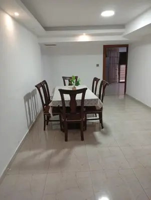 a dining room with a table and chairs at Misk Home in Amman