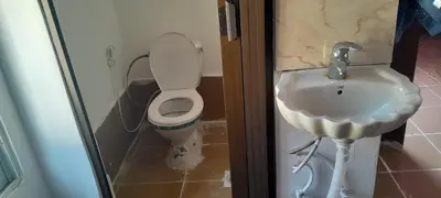 a bathroom with a toilet and a sink at Offgrid Jerash-Ajlune MountainView Studio Shalea شاليه استوديو جبال جرش in Jerash