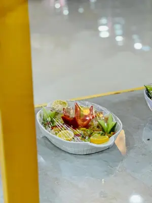 a salad in a bowl on a table at Wadi Rum party luxury camp in Disah