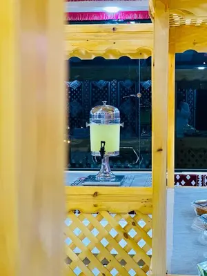a drink in a glass dish in a window at WADI RUM STAR LOTE LUXURY CAMp & BUBBLES ROOM in Wadi Rum