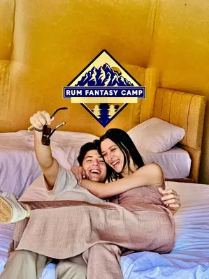 a man and a woman laying on a bed at RUM FANTAS BUBBLE lUXURY CAMP in Wadi Rum