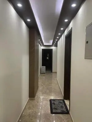 a hallway with a room with a chair in it at اذرح فارم in Udhruḩ