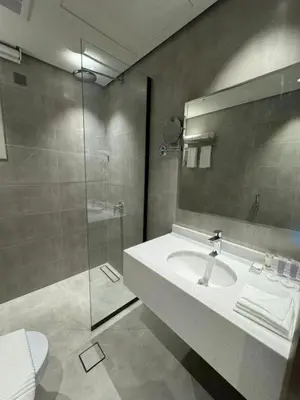 a bathroom with a sink and a shower at ساكب هاوس in Sākib