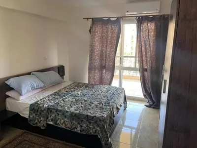 a bedroom with a bed and a window at الجفر موتل in Al Jafr
