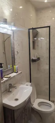 a bathroom with a white toilet and a sink at شقة مفروشة للايجار دوار المشاغل شارع الأقصى in Amman
