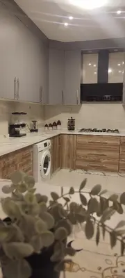 a kitchen with a washer and a washing machine at شقة مفروشة للايجار دوار المشاغل شارع الأقصى in Amman