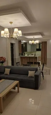 a living room with a couch and a table at شقة مفروشة للايجار دوار المشاغل شارع الأقصى in Amman