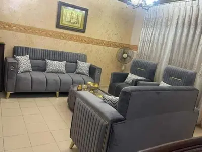 a living room with two couches and a couch at الرمثا هوتل in Ar Ramthā
