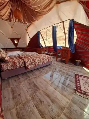 a bedroom with a bed in a tent at Wildlife Camp in Disah