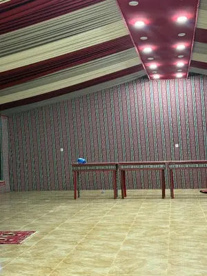 a room with a bench in the middle of a room at Wadi Rum Sunset camp in Disah