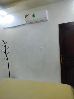 a room with a wall with a air conditioner on the wall at Furnished apartments for rent 1 in Aqaba