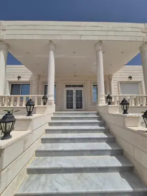 a staircase leading to a building with columns at Reef Palace - Rihab قصر الريف - رحاب in Al Manshīyah