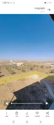 an aerial view of a field with a blue sky at فيلا الاحلام in Irbid