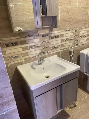 a bathroom with a sink and a toilet at Wadi Rum Quiet luxury camp in Wadi Rum