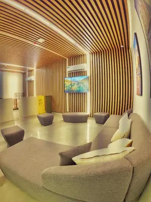 a living room with a couch and chairs at Grand Season Hotel in Aqaba