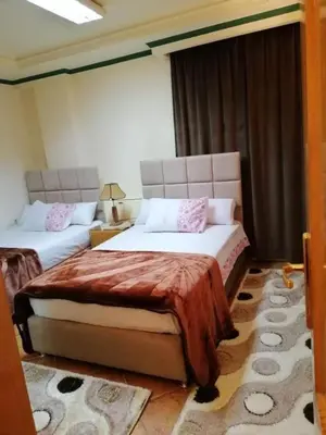 a bedroom with two beds in a room at LINCON inn in Aqaba