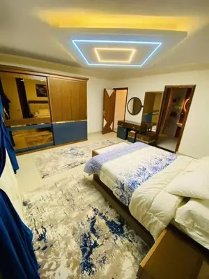 a bedroom with a bed and a large rug at LINCON inn in Aqaba