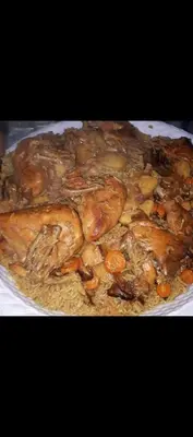 a plate of food with meat and vegetables on it at Dana to explore Bedouin life in Dana