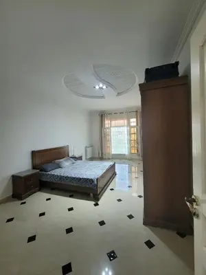 a bedroom with a bed in a room with a ceiling at July house in Wadi Musa
