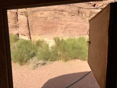 a view of a canyon from a window at Wanderlust Jordan Camp in Wadi Rum