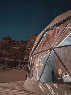 a tent at night in the desert at Rum plaza camp in Wadi Rum