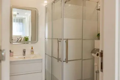 a bathroom with a shower and a sink at Shamsi Apartments 222 in Amman
